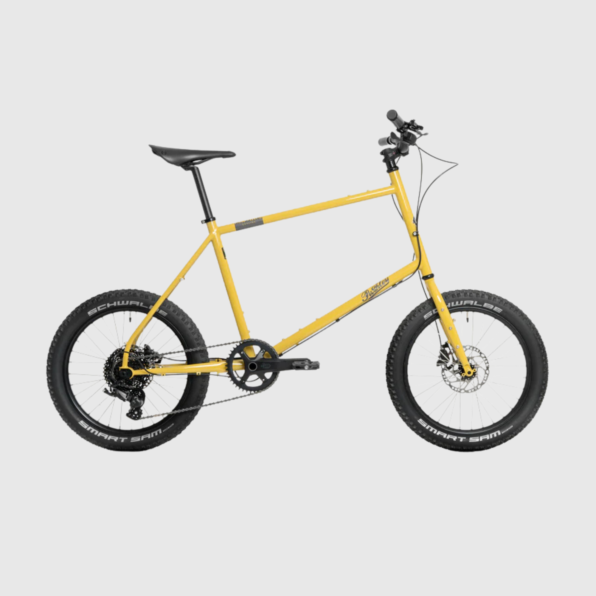 Yellow bicycle on a light gray background