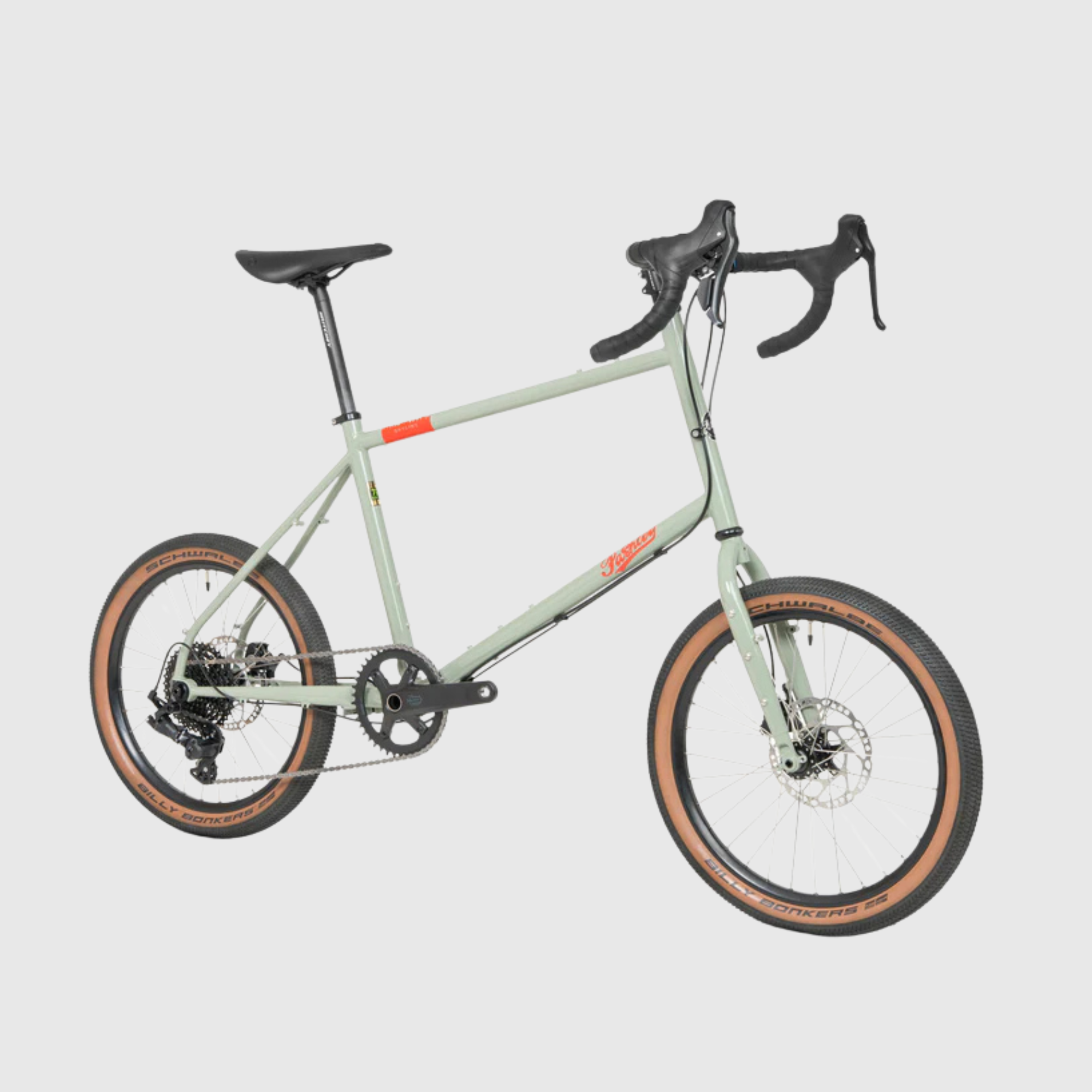 Green bicycle with black components on a light gray background